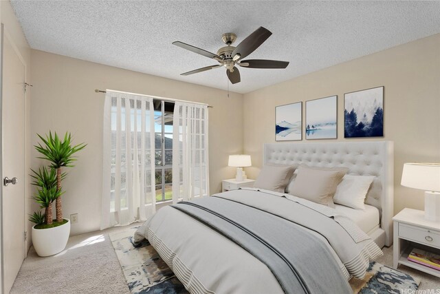 92-1150 Hame St Unit 8205, Kapolei, HI 96707 - carpeted bedroom with a textured ceiling and ceiling fan