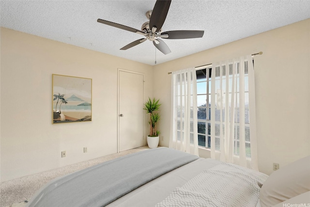 92-1150 Hame St Unit 8205, Kapolei, HI 96707 - bedroom with a textured ceiling and a ceiling fan