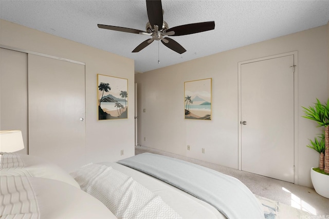 92-1150 Hame St Unit 8205, Kapolei, HI 96707 - carpeted bedroom with a closet, ceiling fan, and a textured ceiling
