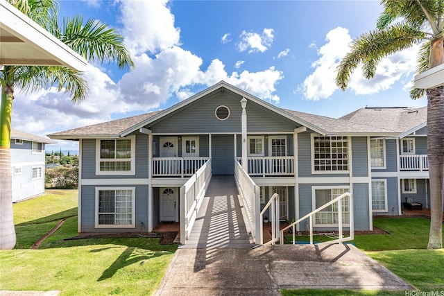 92-1150 Hame St Unit 8205, Kapolei, HI 96707 - view of front of home featuring a front lawn, a shingled roof, and covered porch