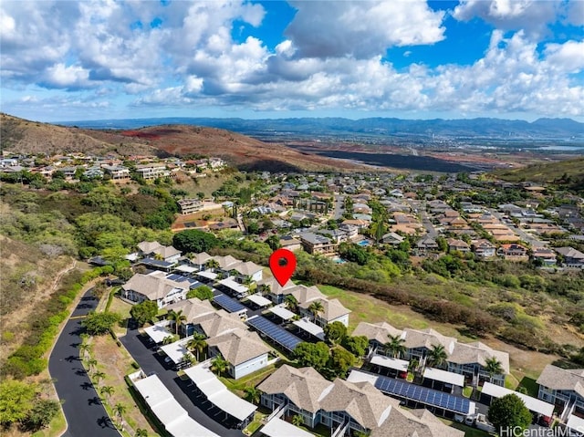 birds eye view of property with a mountain view