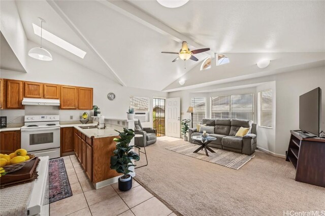 kitchen with ceiling fan, light tile patterned floors, kitchen peninsula, white electric range, and pendant lighting