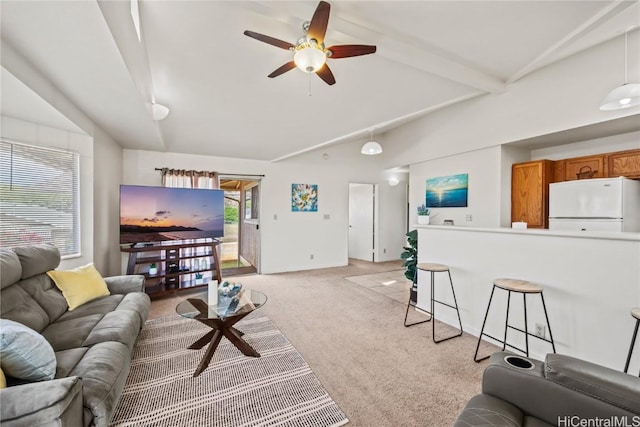 carpeted living room featuring ceiling fan and vaulted ceiling with beams