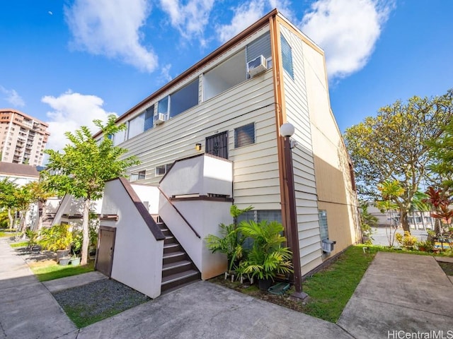 view of front of property with stairway