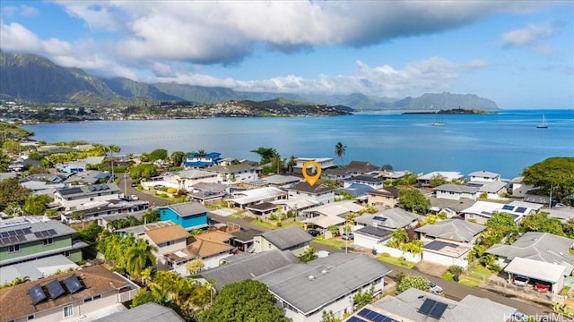 aerial view featuring a water and mountain view