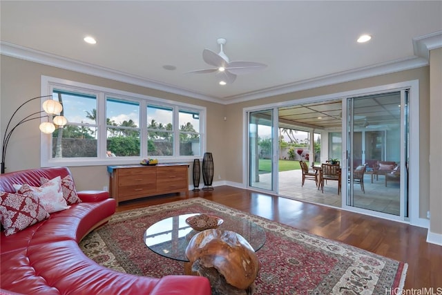 living room with ceiling fan, ornamental molding, and hardwood / wood-style floors