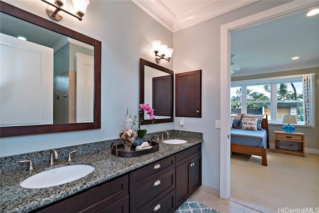 bathroom featuring tile patterned floors, vanity, and ornamental molding