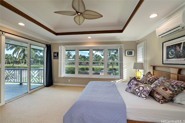 carpeted bedroom with ceiling fan, access to exterior, a wall mounted AC, and a raised ceiling