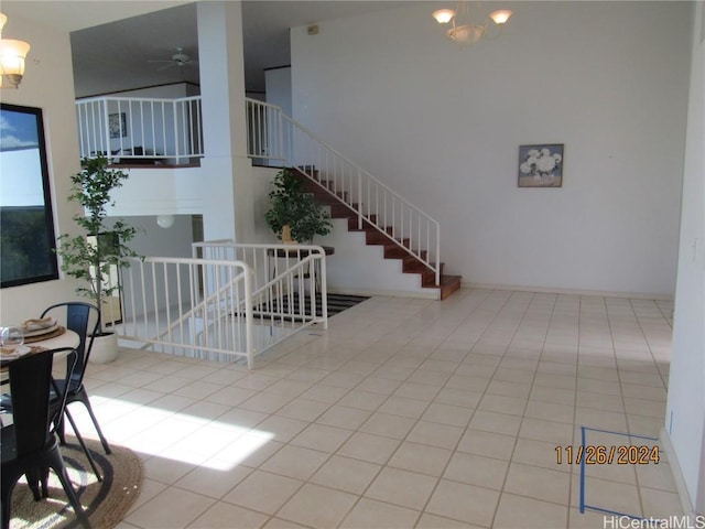 tiled living room with ceiling fan