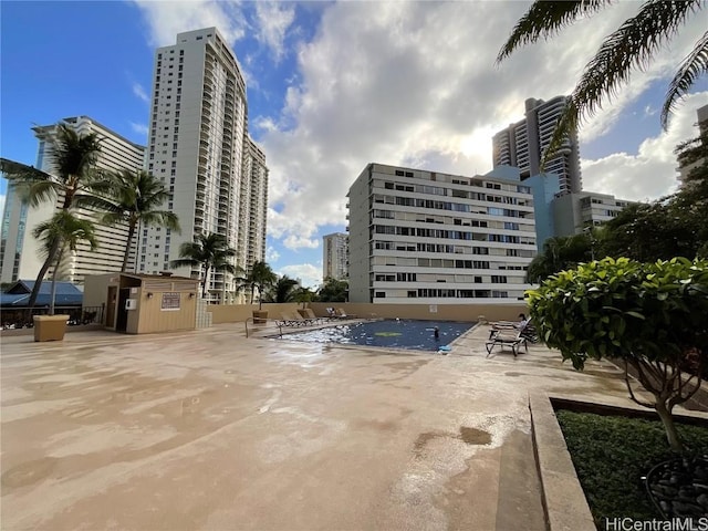 view of swimming pool featuring a patio