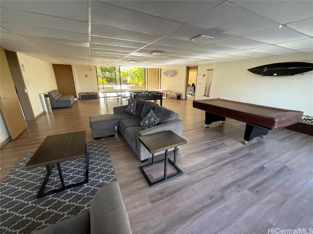 playroom with hardwood / wood-style flooring, a paneled ceiling, floor to ceiling windows, and billiards