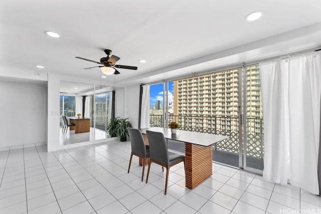 tiled dining area featuring ceiling fan