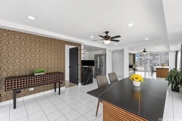 dining room featuring ceiling fan and light tile patterned floors