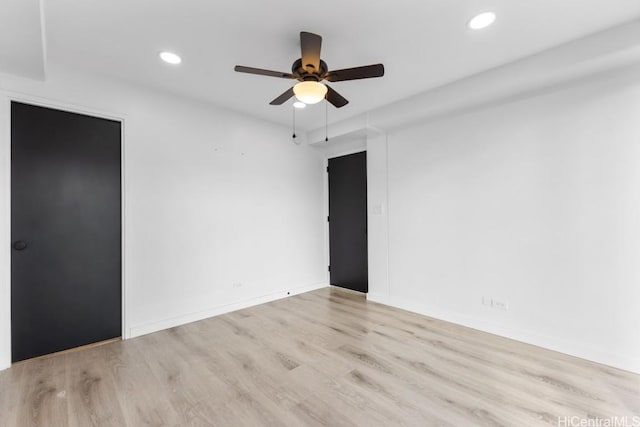 unfurnished room featuring ceiling fan and light hardwood / wood-style floors