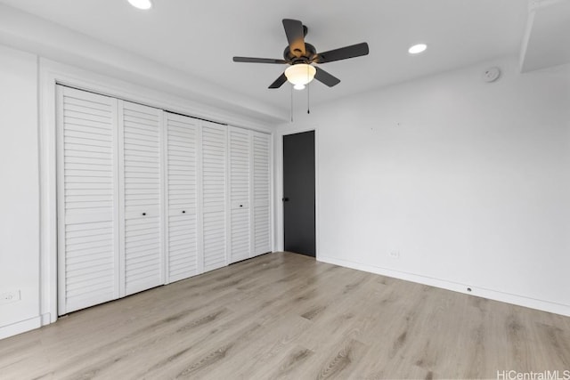 unfurnished bedroom featuring light wood-type flooring and ceiling fan