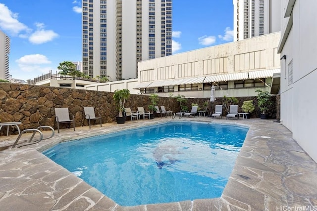 view of swimming pool with a patio area