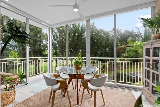 sunroom with plenty of natural light and ceiling fan