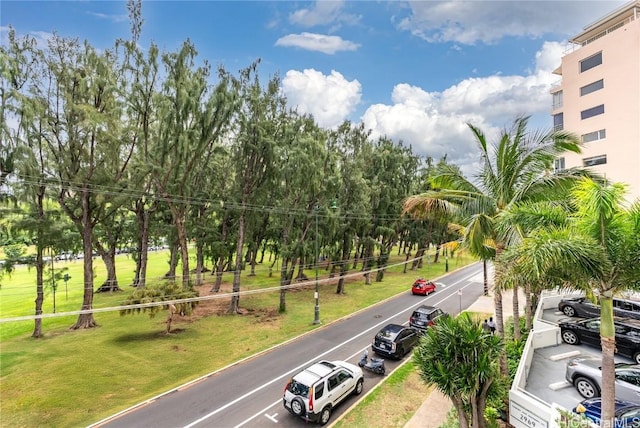 view of home's community featuring a lawn