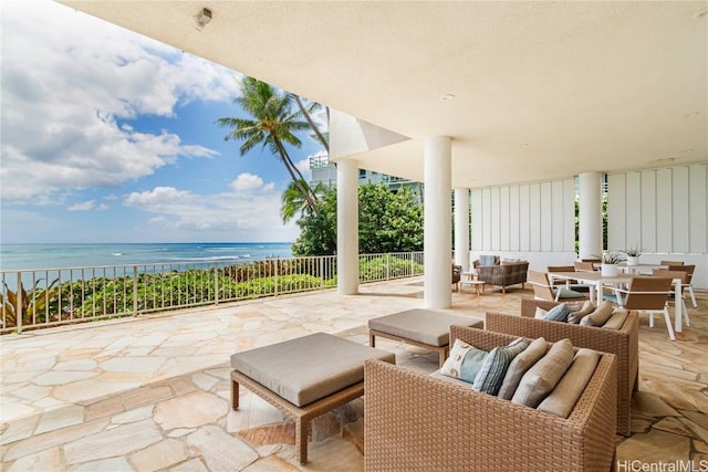 view of patio with outdoor lounge area and a water view