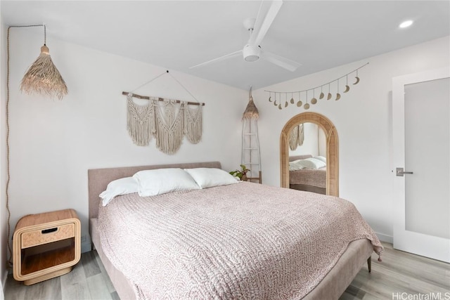 bedroom featuring light hardwood / wood-style flooring and ceiling fan