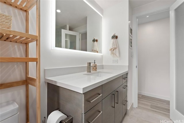 bathroom with vanity and toilet