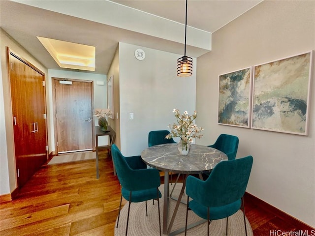 dining room featuring wood-type flooring