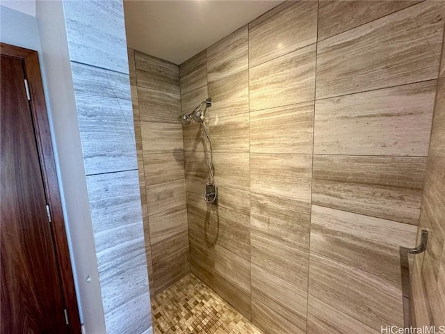 bathroom with tiled shower