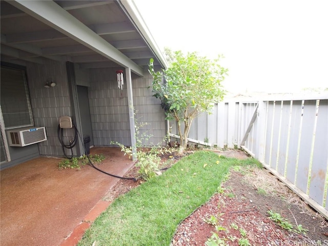 view of yard featuring a wall mounted AC