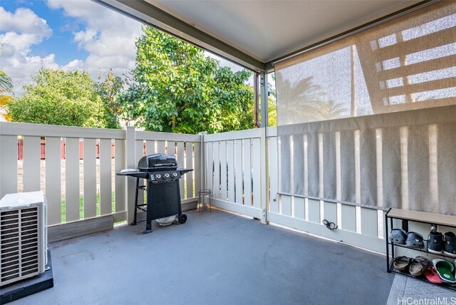 view of patio / terrace featuring area for grilling and cooling unit