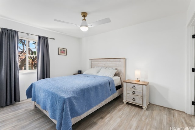 bedroom with ceiling fan and light hardwood / wood-style flooring