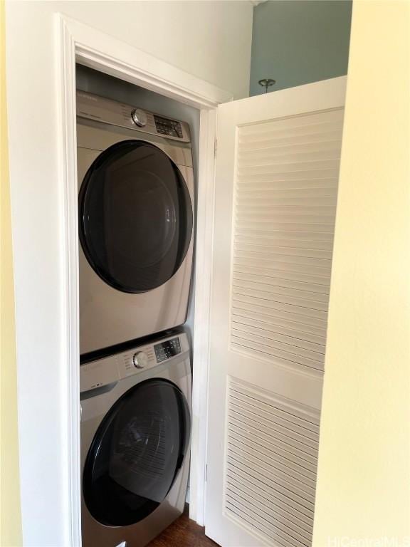 laundry room with stacked washer and clothes dryer