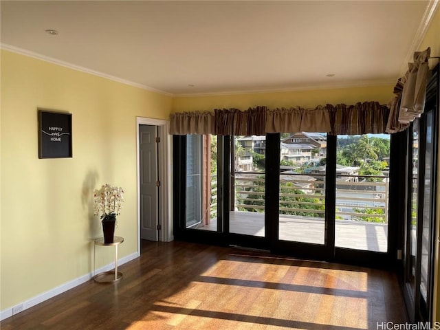 interior space with crown molding and dark wood-type flooring