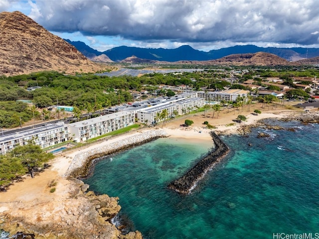 birds eye view of property featuring a water and mountain view