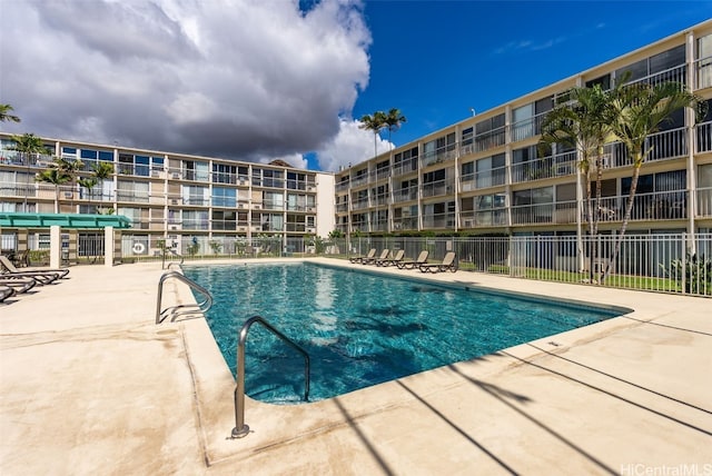 view of swimming pool with a patio area