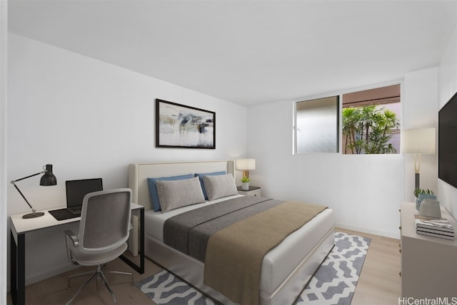 bedroom with light hardwood / wood-style flooring