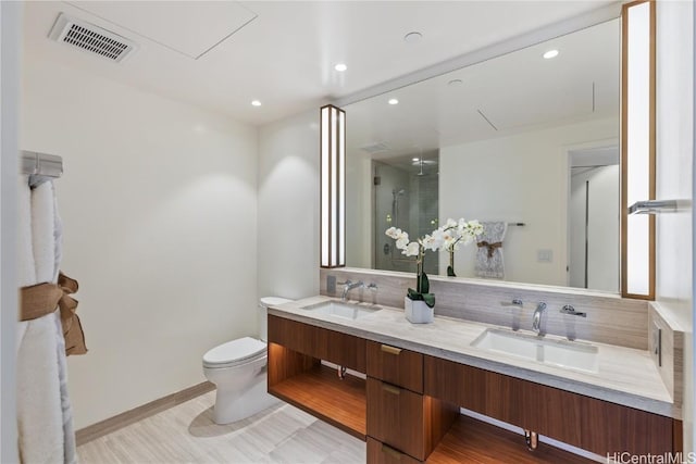 bathroom featuring backsplash, toilet, vanity, and walk in shower