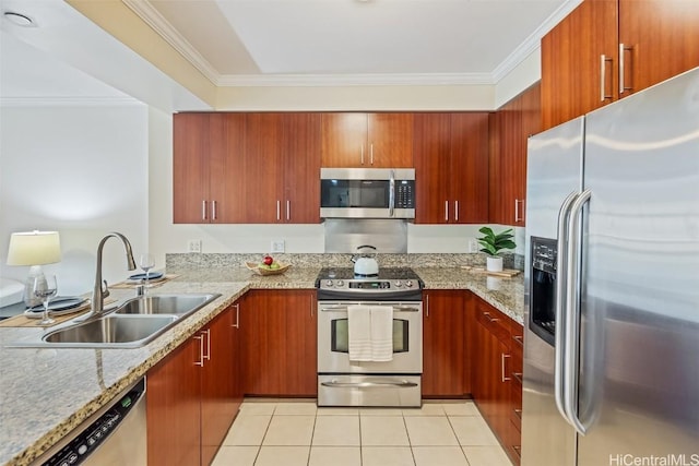 kitchen featuring sink, ornamental molding, light tile patterned flooring, light stone counters, and stainless steel appliances