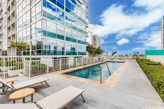 view of swimming pool with a patio