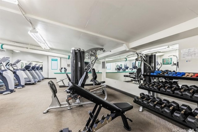 exercise room with baseboards