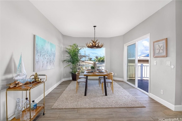 office area featuring a notable chandelier and dark hardwood / wood-style floors