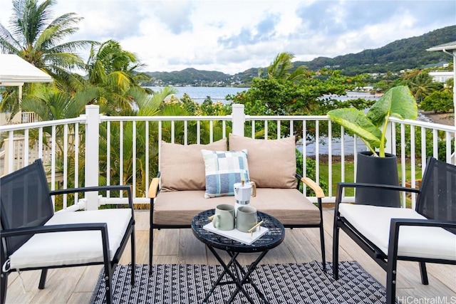 balcony with a water and mountain view