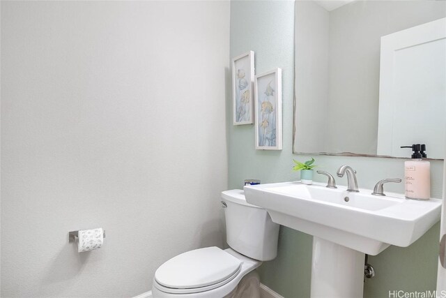 bathroom with sink and toilet