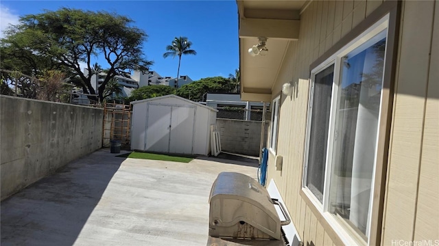 view of patio / terrace featuring a shed