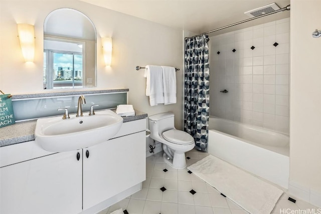 full bathroom featuring tile patterned flooring, shower / tub combo, vanity, and toilet