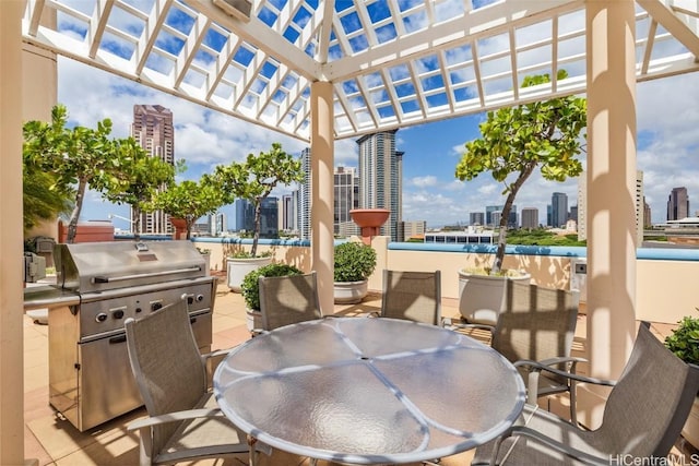 view of patio / terrace with a pergola and grilling area