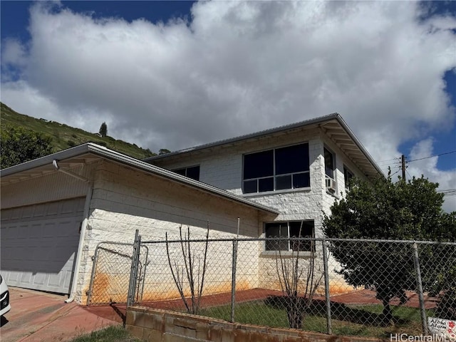 view of side of property featuring a garage