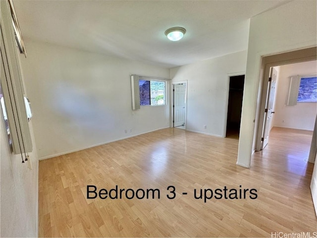 unfurnished room featuring light hardwood / wood-style floors