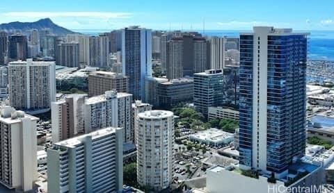 property's view of city featuring a mountain view