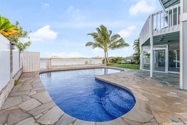 view of swimming pool with a patio area