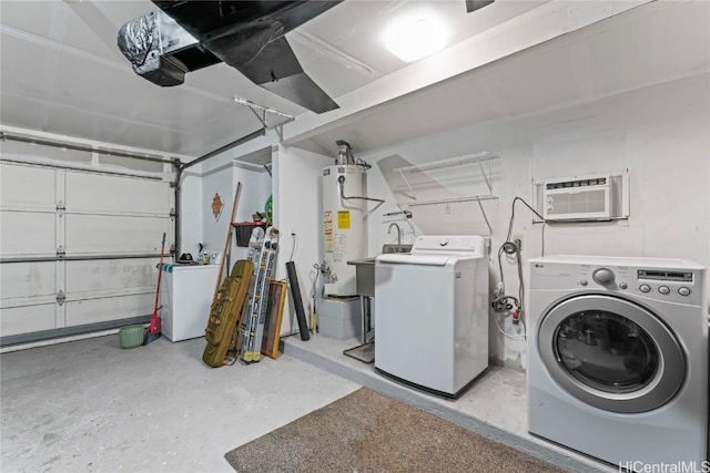 laundry area featuring independent washer and dryer, water heater, and a wall unit AC